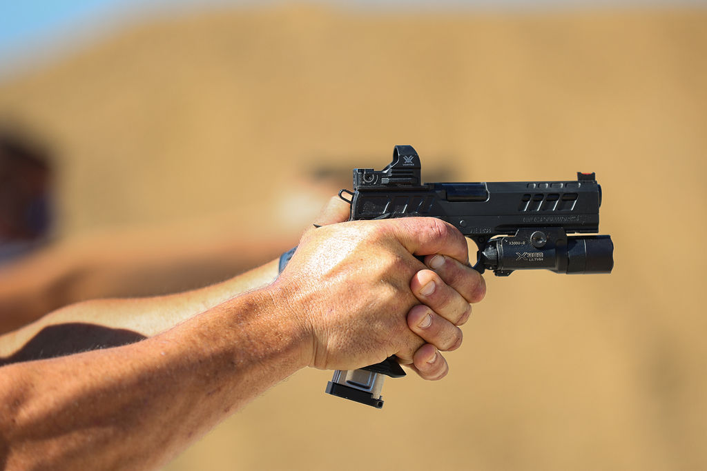 Shooting Range Member Shooting Pistol